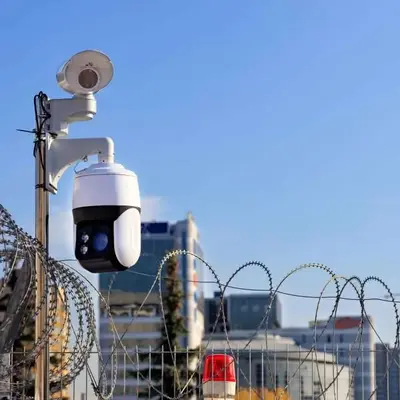 Fence with razor wire, cctv, and alarm beacon