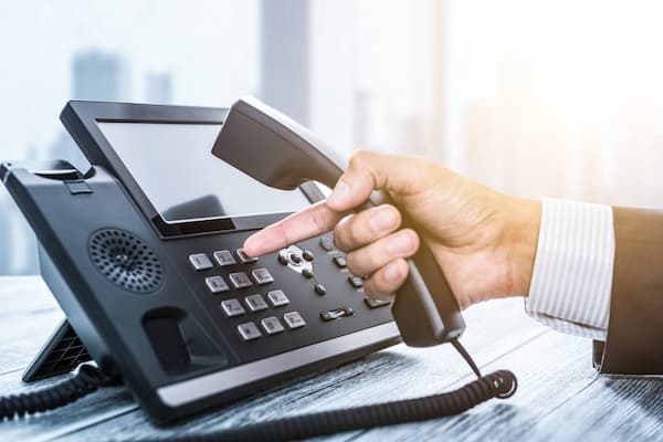 A lady talking to others through video intercom